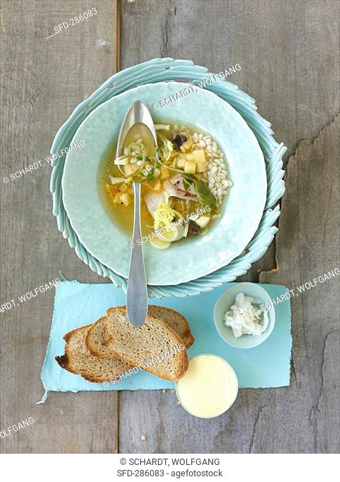 Swede soup with cured pork and dried fruit