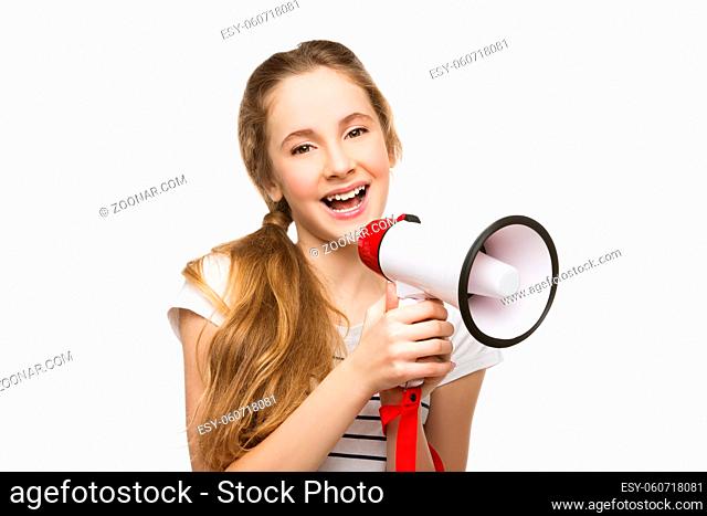 Beautiful teenage girl with blond hair screaming into megaphone. Happy expression. Isolated on white background. Copy space