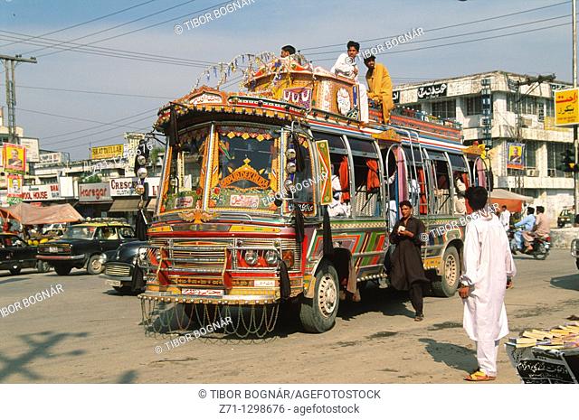 Pakistan, Punjab, Rawalpindi, street scene, bus, traffic, people