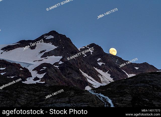 moon rise behind the veneziaspitzen a mountain range of the ortler alps between the italian provinces of south tyrol and trentino in the stelvio national park