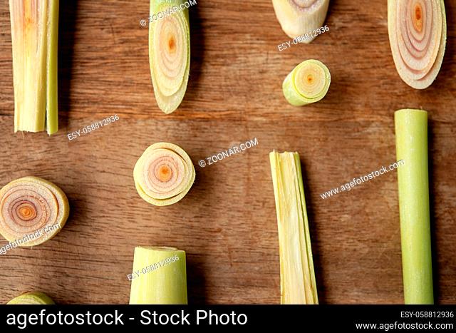 Fresh green lemongrass slices on wooden background