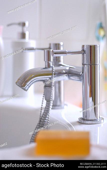 Modern chrome bath tap with soap