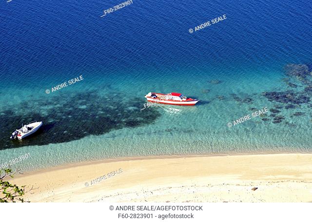 Boats docked in a beach in Nukutapu islet, Wallis Island, Wallis and Futuna, Melanesia, South Pacific