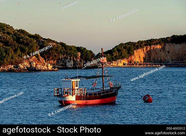 Ksamil, Albania A small boat in the harbor at dawn