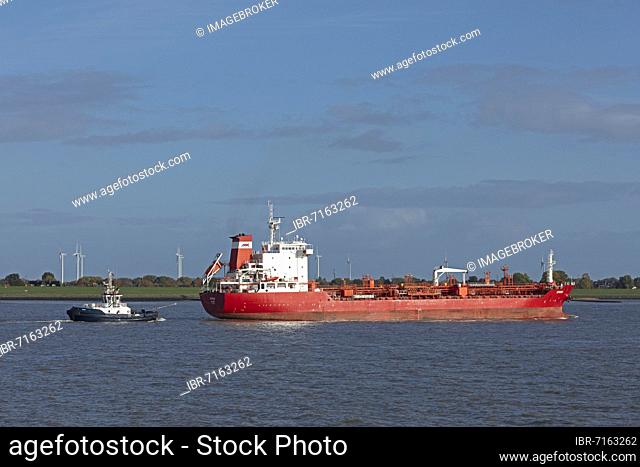 Tugboat guiding cargo ship, Elbe, Brunsbüttel, Schleswig-Holstein, Germany, Europe