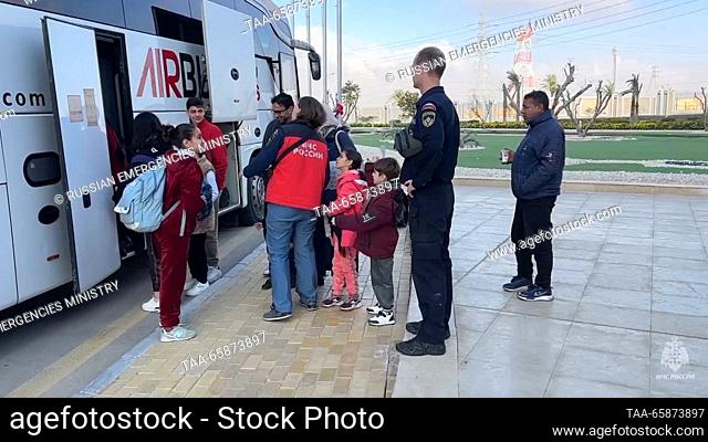 EGYPT, CAIRO - DECEMBER 18, 2023: Russian citizens evacuated from the zone of the Israeli-Palestinian conflict are seen by a bus of the Russian Emergencies...