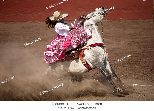 "An escaramuza sits on her horse before competing in an Escaramuza in the Lienzo Charros el Penon, Mexico City, Sunday, January 19, 2013