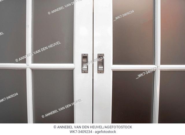 sliding glass and wood door close-up, vintage design home concept background texture