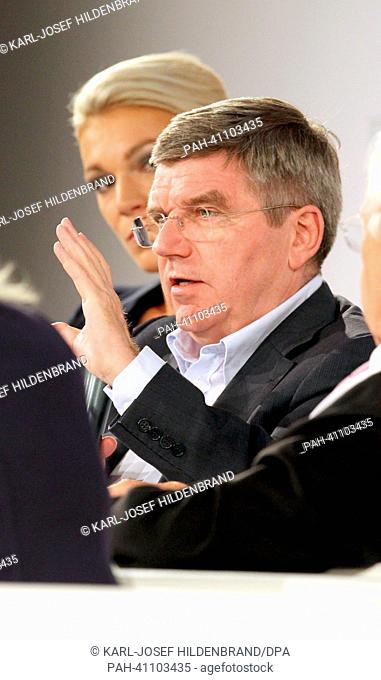 Thomas Bach, vice president of the International Olympic Committee and president of the German Olympic Sports Confederation (R) and ski racer Maria Hoefl-Riesch...