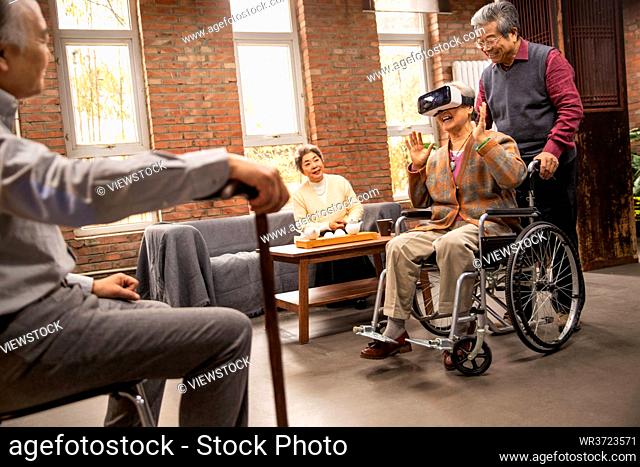 Elderly men gather in VR glasses together