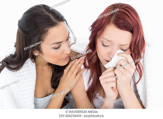 Young woman consoling a crying female friend
