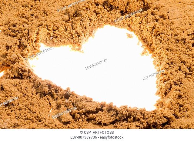 Heart drawn on sand
