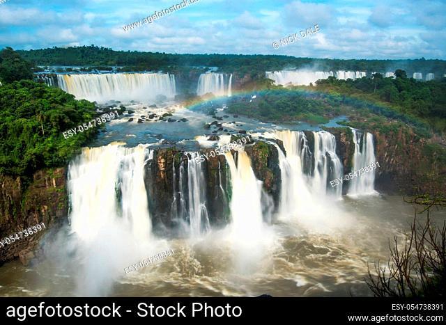 Two lines of Iguazu Falls with rainbow