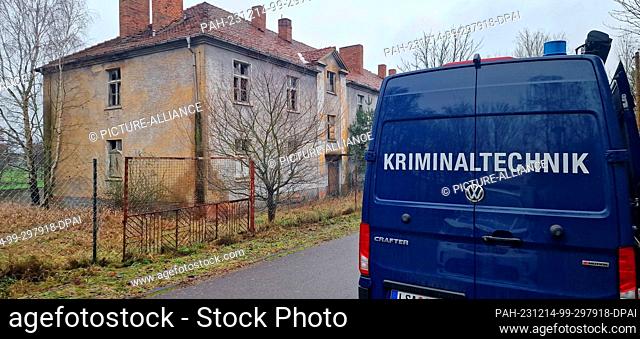 14 December 2023, Saxony-Anhalt, Stendal: A forensics vehicle is parked next to an empty building a few kilometers west of Stendal