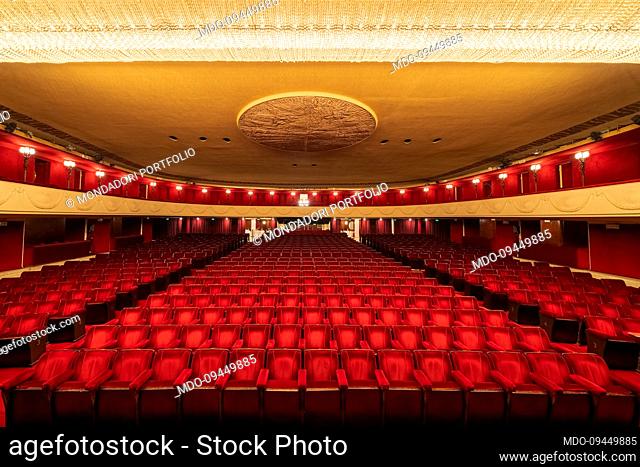 Overview of the Teatro Manzoni stalls, entirely covered with red velvet upholstery. In the center of the ceiling, the bas-relief medallion by the italian...