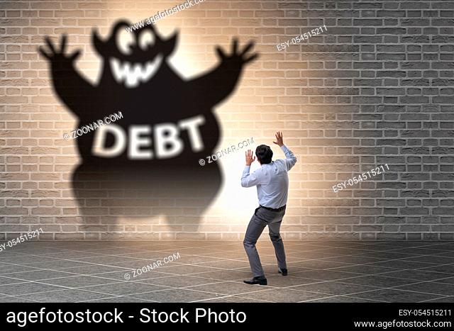 Businessman in the debt and loan concept