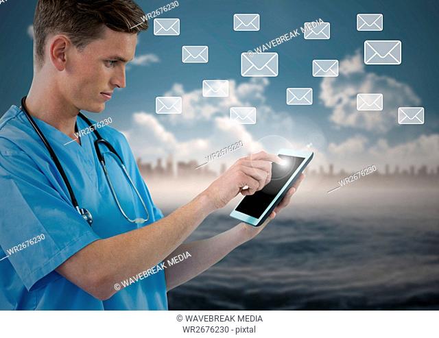 Doctor using digital tablet with digitally generated message icons