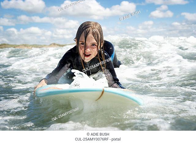 Mother and daughter surfing