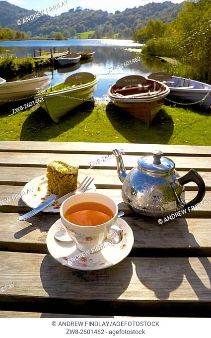 The Lake District. Afternoon Tea in front of beached boats. Grasmere, Lake District National Park, Cumbria, England, United Kingdom