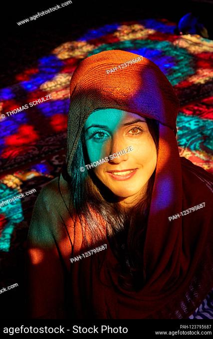 Portrait of a young woman in the Nasir-ol-Molk Mosque (Persian Masjed-e Nasir-ol-Molk), also known as the Pink Mosque in the Iranian city of Shiraz, taken on 02