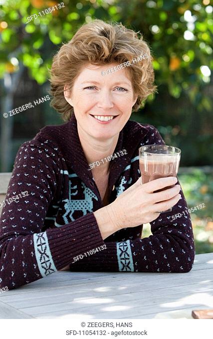 A woman drinking hot chocolate