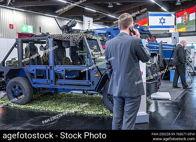 PRODUCTION - 28 February 2023, Bavaria, Nuremberg: Military vehicles are on display at the Rheinmetall stand, including the Caracal airborne vehicle