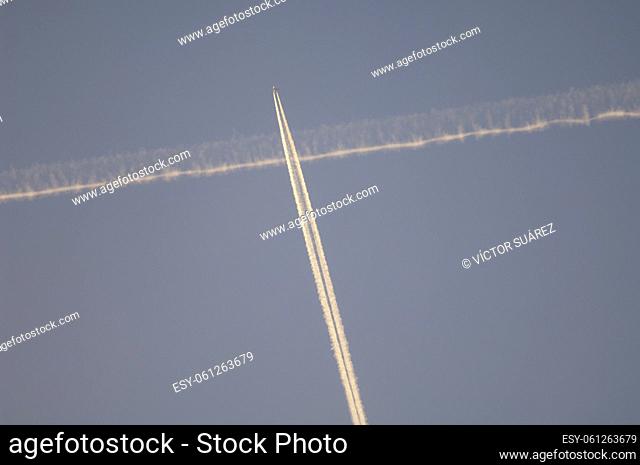 Airplane and contrail of another airplane. Huesca. Aragon. Spain
