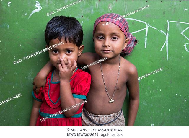 Portrait of 2 children, girl and a boy. Bangladesh