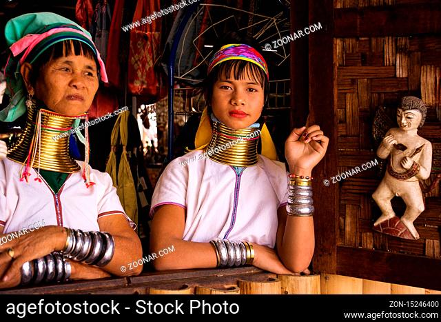 INLE LAKE, MYANMAR - May 19, 2019: Portrait of two Kayan Lahwi tribe women with neck rings. Long neck woman