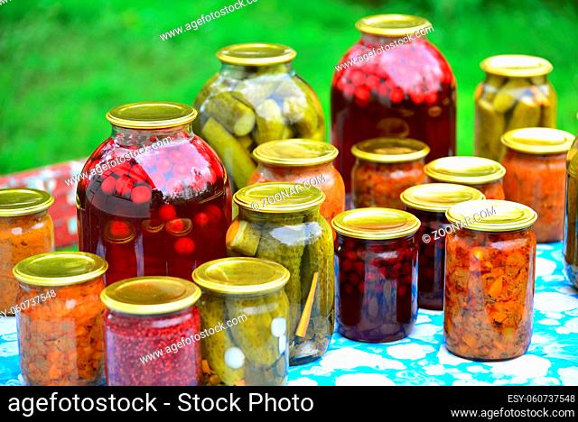 a Home canned vegetables in the garden in summer