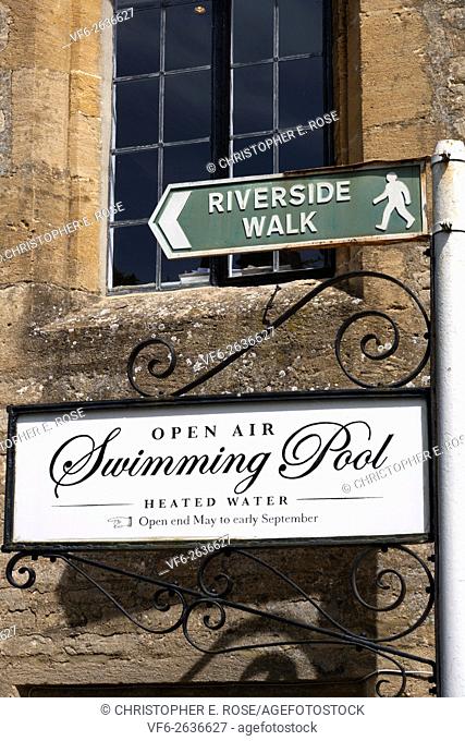 Ornate open air swimming pool sign, Cirencester, Gloucestershire, UK