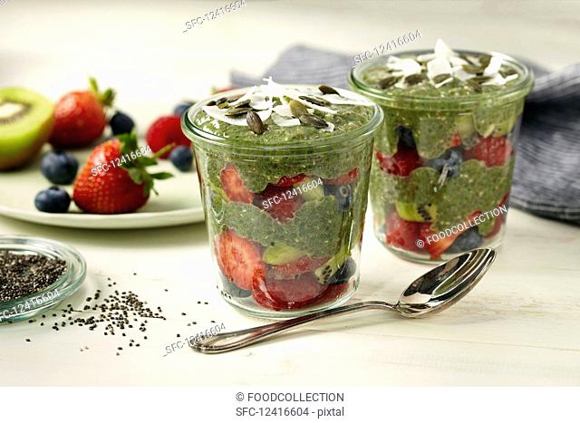Matcha chia pudding with strawberries in glass jars