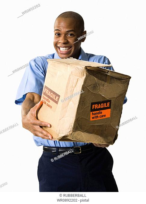 Portrait of a African-American mailman with a damaged package