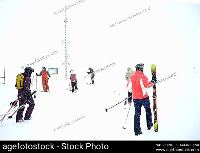 01 December 2023, Bavaria, Grainau: Skiers take to the slopes at the opening of the ski season on the Zugspitze. Photo: Angelika Warmuth/dpa