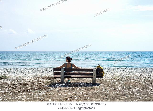 he girl on the bench in the background the Mediterranean sea