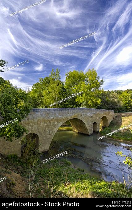 Romanesque bridge of Artigue and river Osse near Larressingle on route to Santiago de Compostela, UNESCO World Heritage Site, departement Gers, France