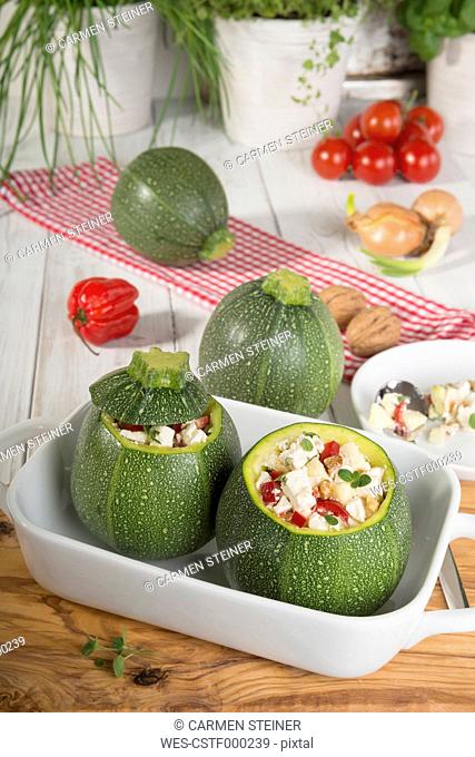 Filled eight ball squashes with feta cheese and tomato in gratin dish, Low Carb