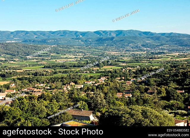 Panoramic view of cultivated fields, vineyards and mountains in Provence, France