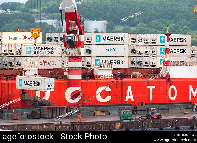 Crane unloaded container cargo ship Sevmorput Rosatomflot - Russian nuclear-powered icebreaker lighter aboard ship carrier