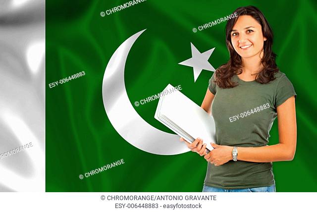 Young female student smiling over Pakistani flag