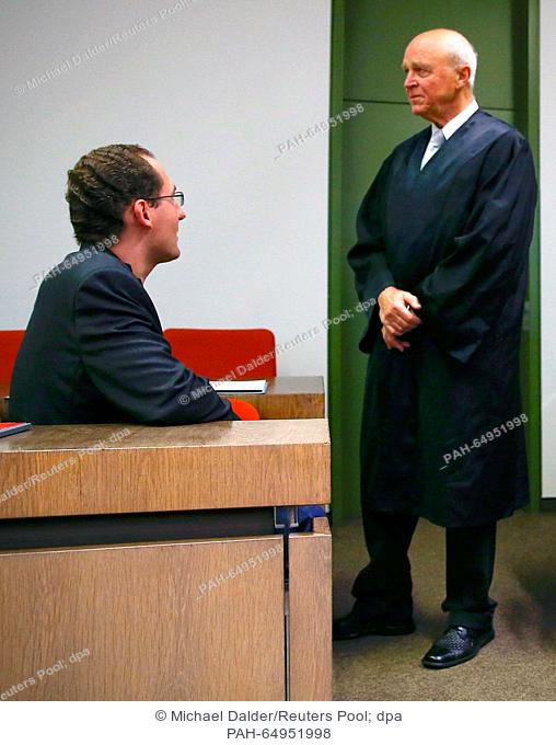 Defendant Markus R., a former employee of Germany's foreign intelligence agency (BND) talks to his lawyer Klaus Schroth (R) prior to his trial for espionage in...