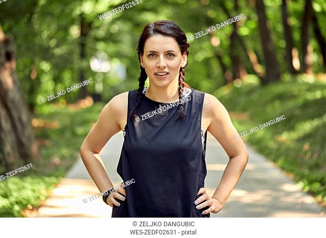 Portrait of sporty young woman in forest