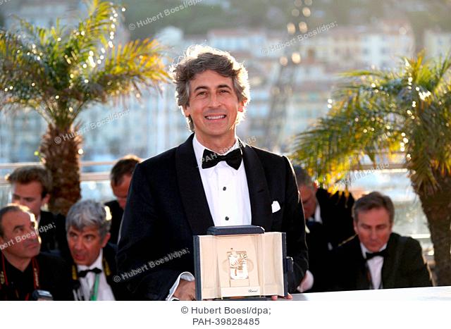 Director Alexander Payne poses with the award for best actor winner Bruce Dern from Payne's movie ""Nebraska"" at the Winner's Photo Call during the 66th Cannes...