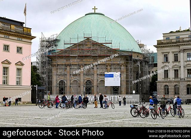 17 August 2021, Berlin: Construction work is underway at Bebelplatz on and in the scaffolded St. Hedwig's Cathedral, the Episcopal Church of the Archdiocese of...
