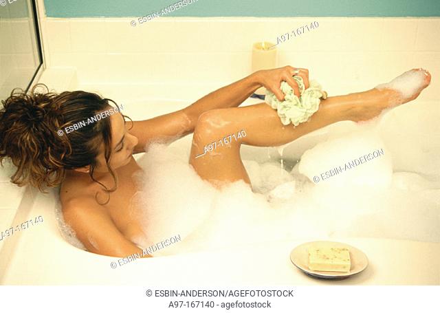 Sexy woman takes bubble bath