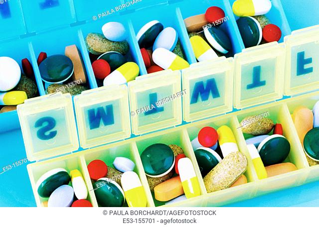 Multicolored pills in pill cases