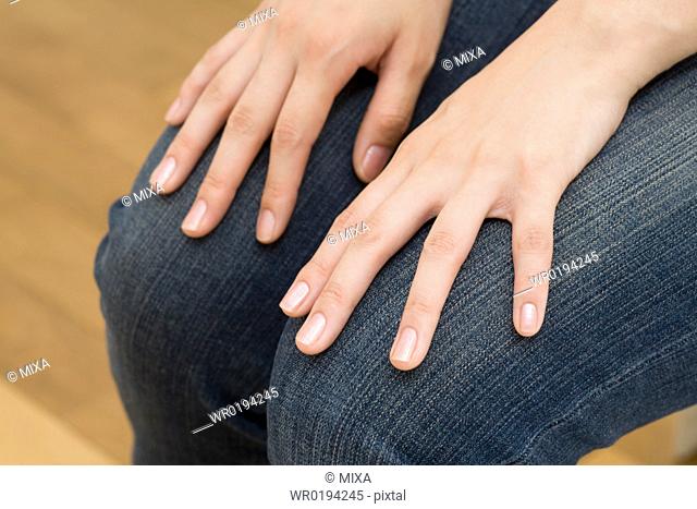 Woman's hands on her lap