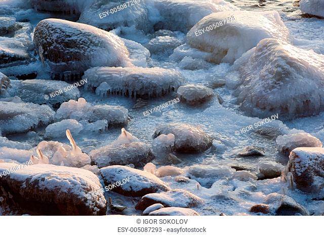 The marine stones covered by an ice, close up