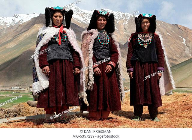 INDIA, RANGDUM, 27.06.2014, Ladakhi women dressed in traditional outfits and wearing perak headdresses in a small village in Rangdum, Ladakh, Jammu and Kashmir
