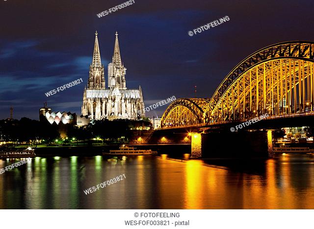 Germany, Cologne, View of Cologne Cathedral and Hohenzollern Bridge with River Rhine